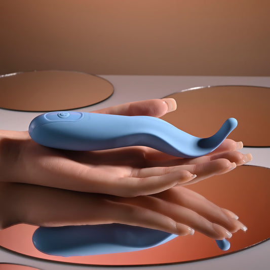 Blue electronic device held in hands with a neutral background