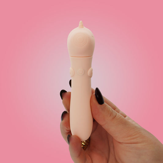 Unihorn USB Bullet. The pink bullet on a coloured surface, tighter crop.