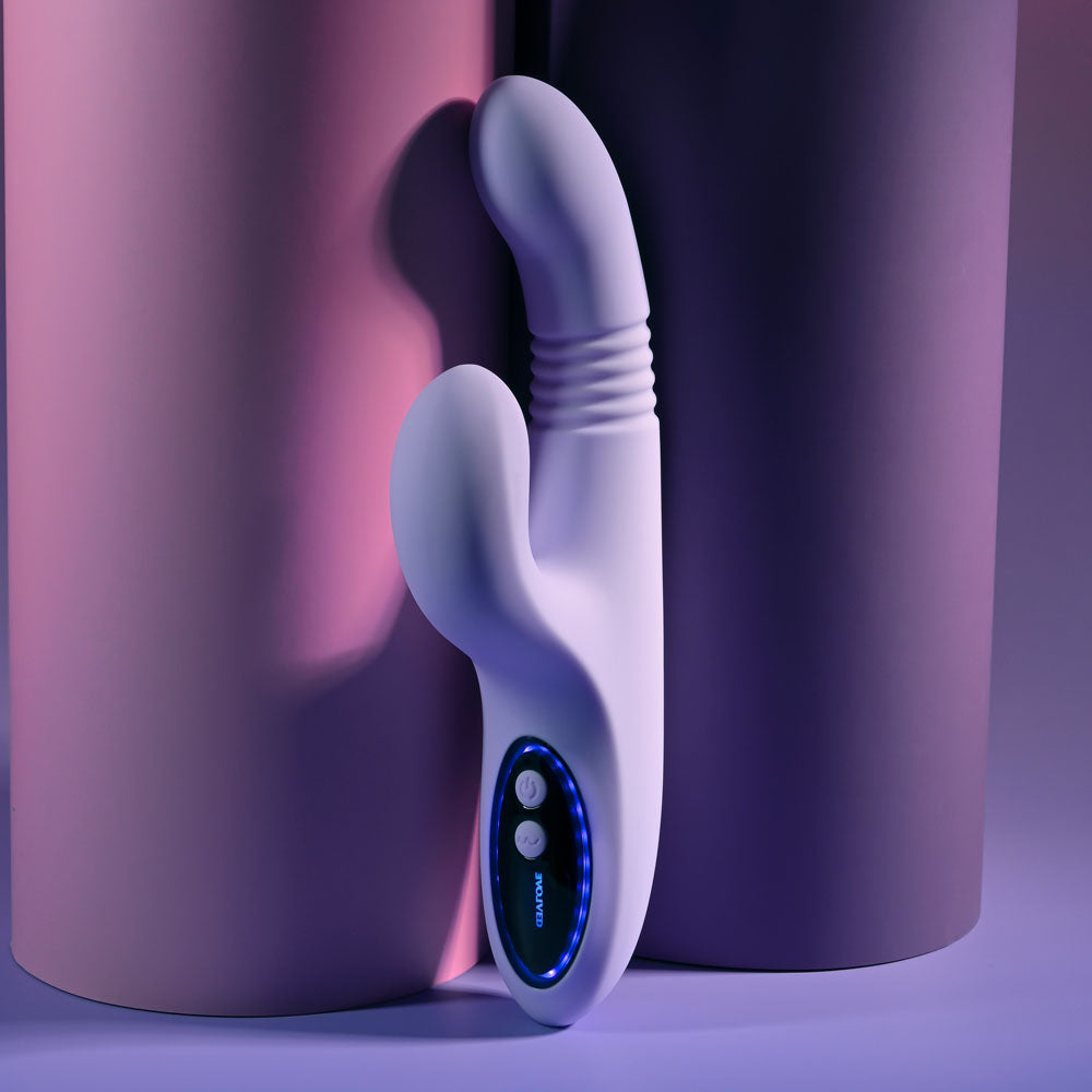 Evolved PEP TALK Purple 23.3 cm Thrusting Vibrator with Tapping. Styled with other products, a further angle.