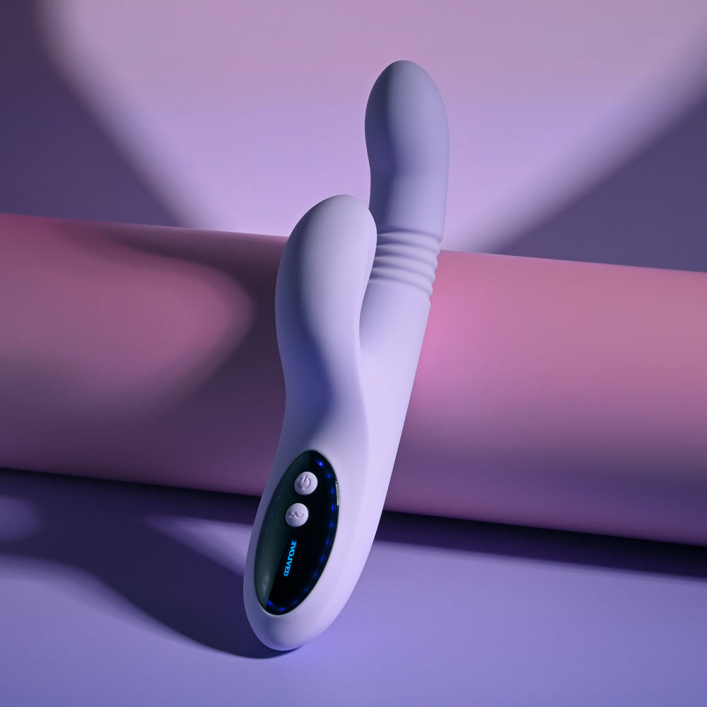 Evolved PEP TALK Purple 23.3 cm Thrusting Vibrator with Tapping. Styled with other products, a third view.