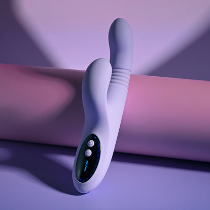 Evolved PEP TALK Purple 23.3 cm Thrusting Vibrator with Tapping. Styled with other products, a third view.