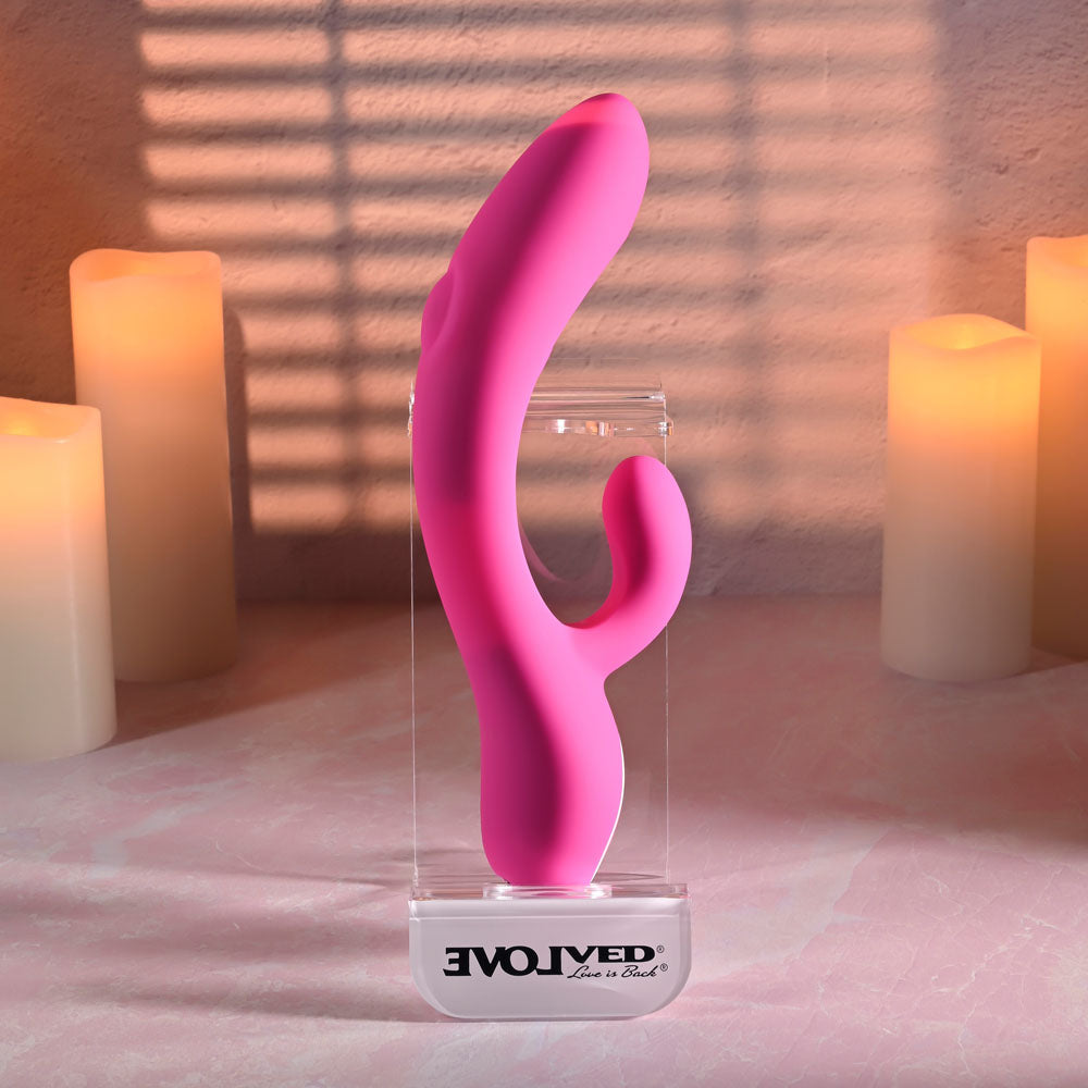 Evolved G-TAPPER Pink USB Rechargeable Rabbit Vibrator. Styled with other products, a fourth view.