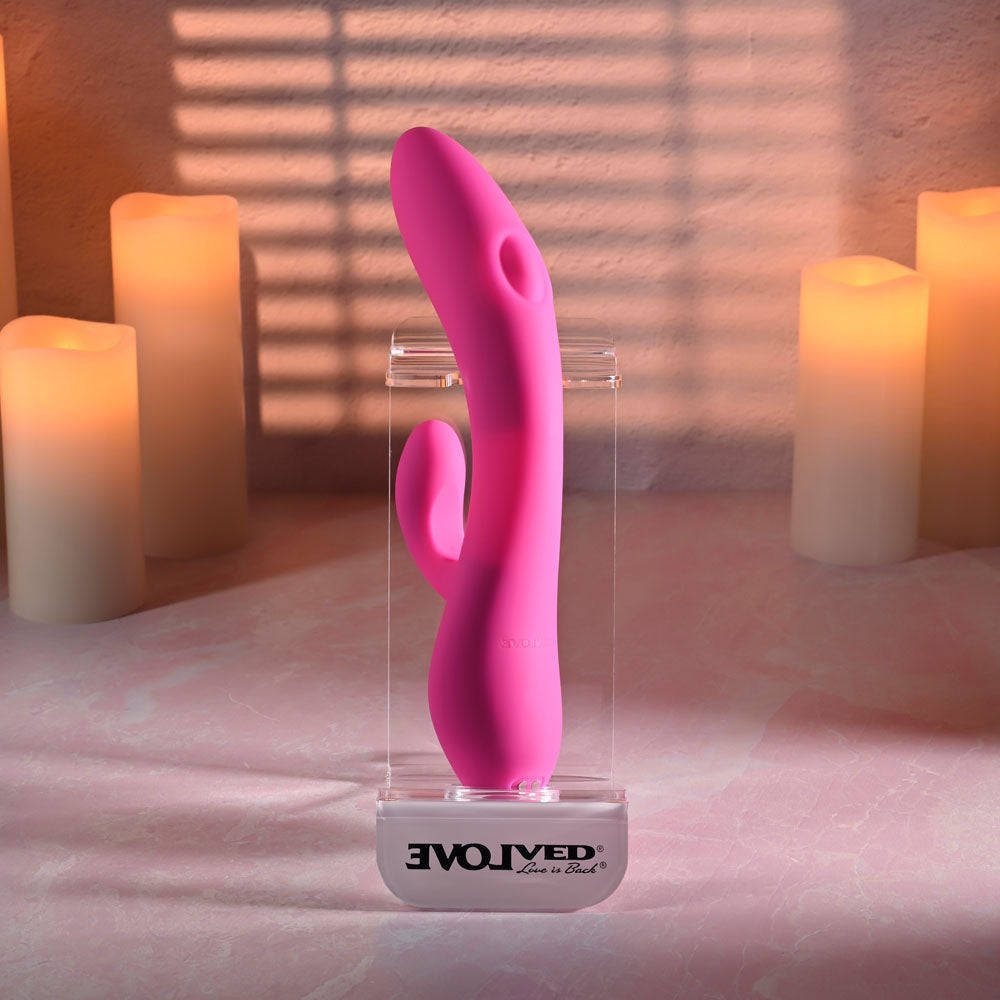 Evolved G-TAPPER Pink USB Rechargeable Rabbit Vibrator. Styled with other products, a fifth view.