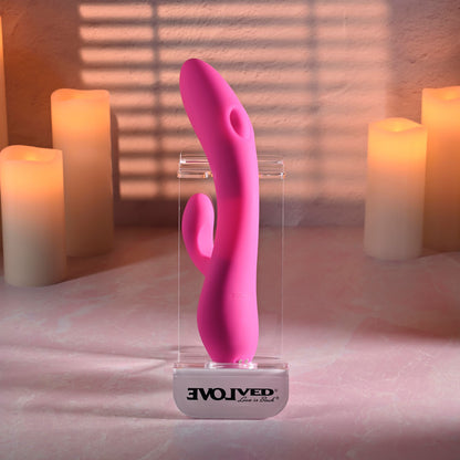 Evolved G-TAPPER Pink USB Rechargeable Rabbit Vibrator. Styled with other products, a fifth view.