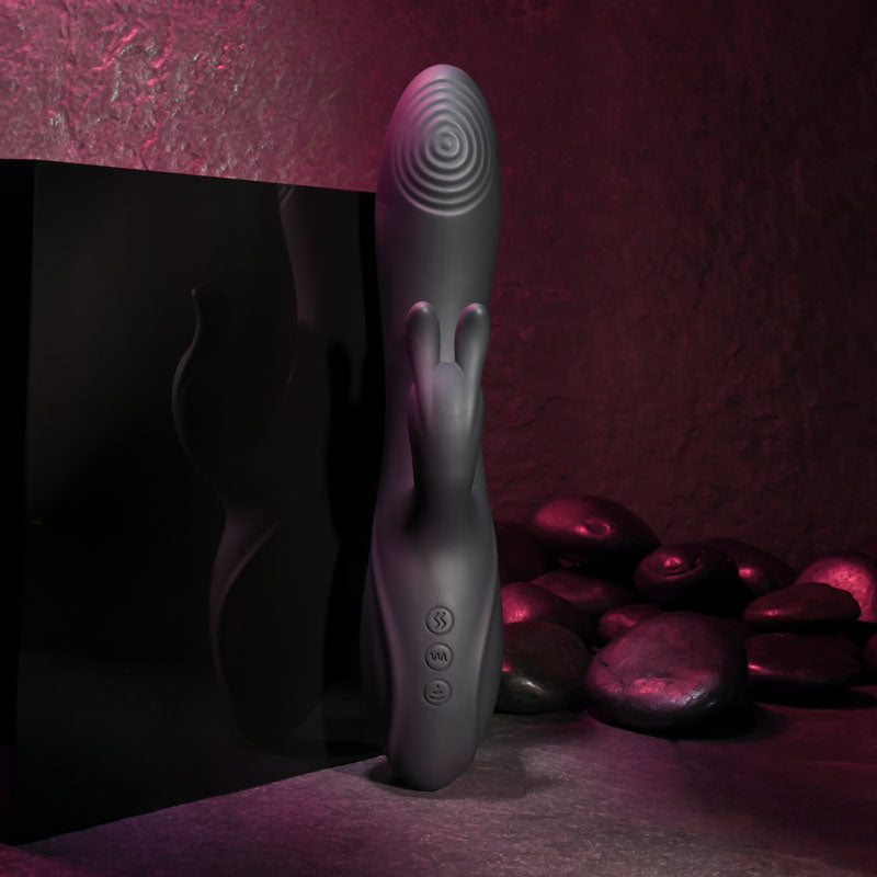Evolved RABBIT HOLE. The black vibrator on a coloured surface, another angle.