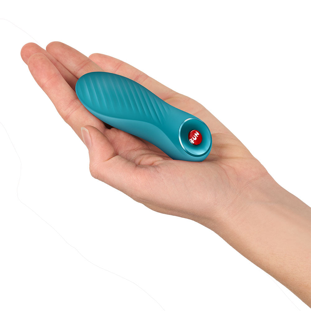 Fun Factory BIJOU Aquamarine USB-C Rechargeable Stimulator. Studio photo of the blue product on a white background, a further angle.