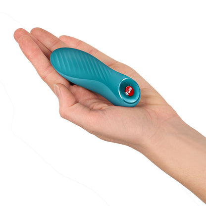 Fun Factory BIJOU Aquamarine USB-C Rechargeable Stimulator. Studio photo of the blue product on a white background, a further angle.