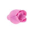 Pink silicone flower-shaped object on a white background
