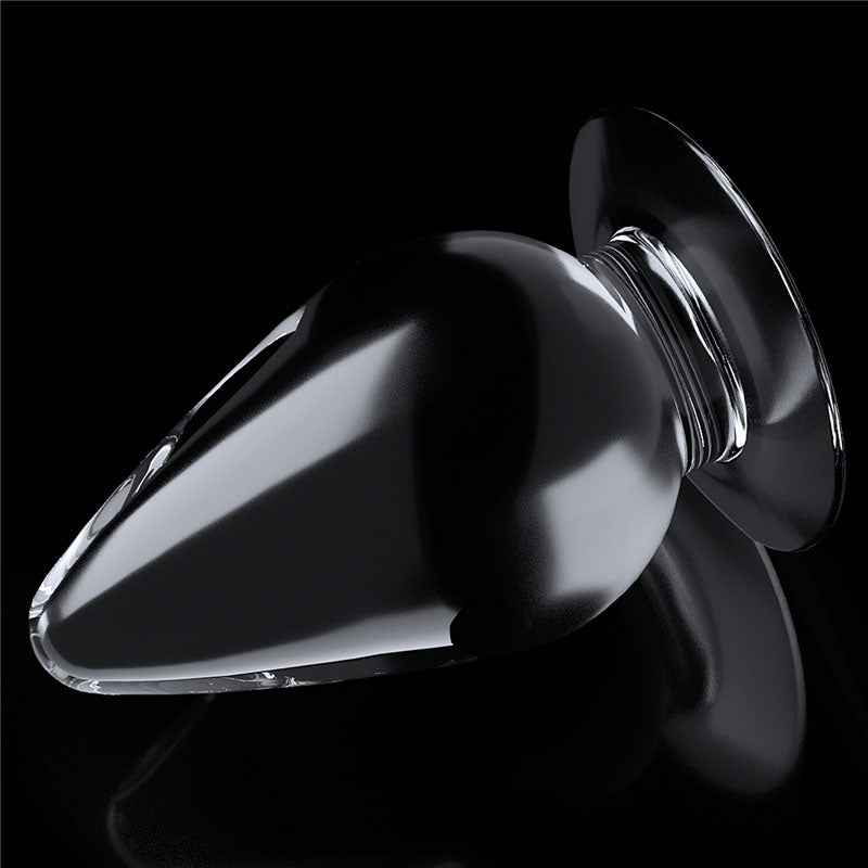 Flawless Clear Anal Plug 4.5''. The butt plug on a coloured surface, another angle.