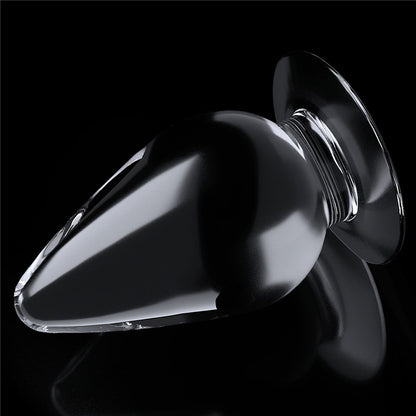 Flawless Clear Anal Plug 4.5''. The butt plug on a coloured surface, another angle.