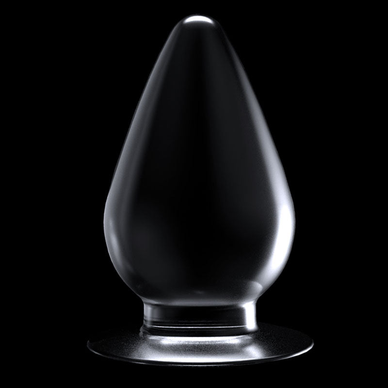 Flawless Clear Anal Plug 4.5''. The butt plug on a coloured surface, a further angle.