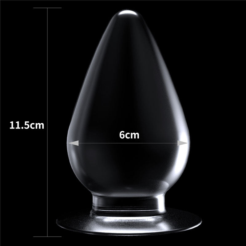 Flawless Clear Anal Plug 4.5''. The butt plug on a coloured surface, a third view.