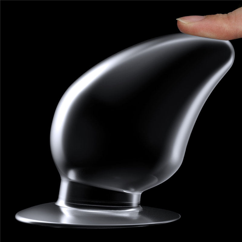 Flawless Clear Anal Plug 4.5''. The butt plug on a coloured surface, a fourth view.
