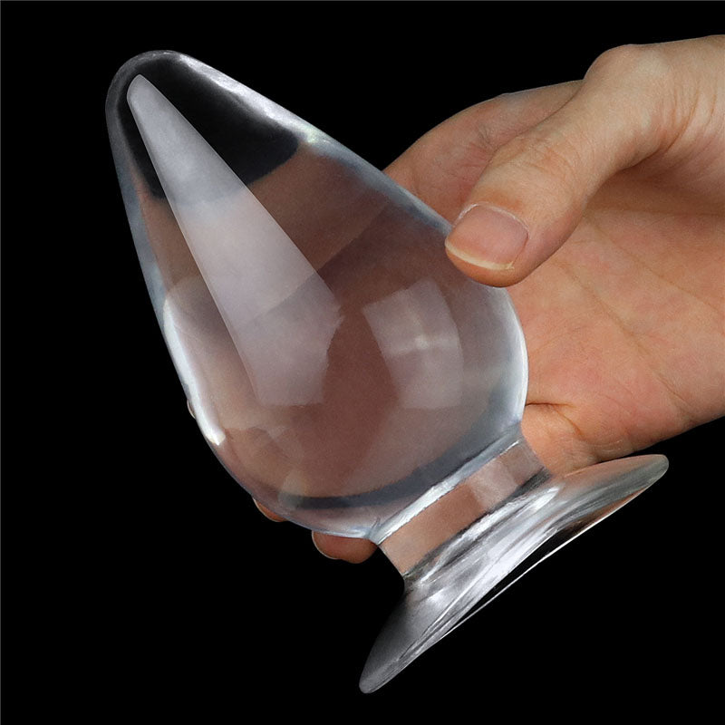 Flawless Clear Anal Plug 4.5''. The butt plug on a brown surface.
