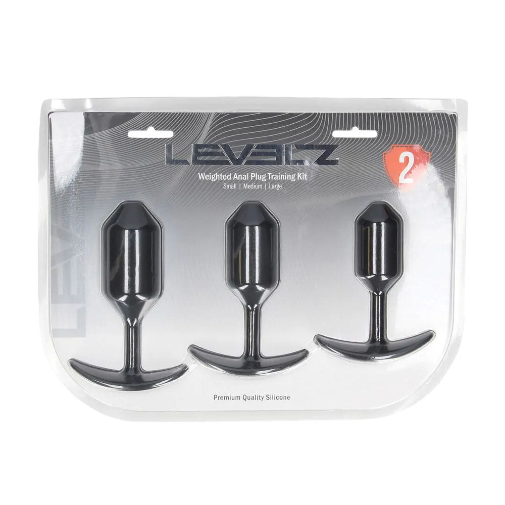 LEVELZ Silicone Weighted Anal Plug Training Set. Studio photo of the black plug on a white background, a further angle.