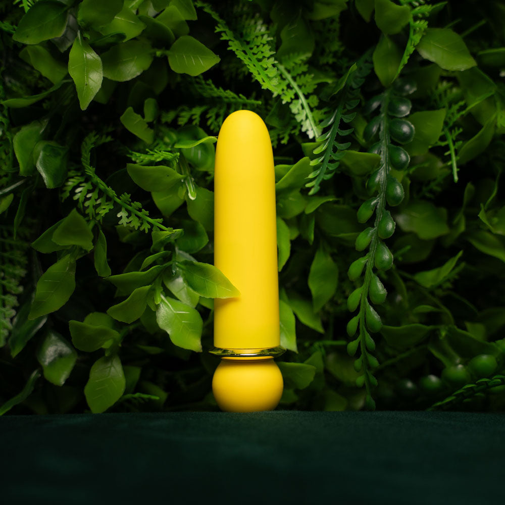 Yellow object on a green leafy background