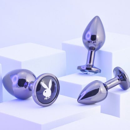 Playboy Pleasure PLEASURE 3 WAYS. The purple product on a wet blue surface, a third view.