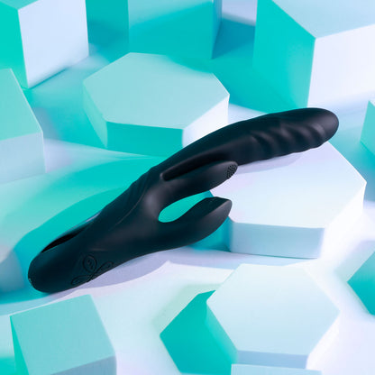Black glove on a geometric, multicolored surface