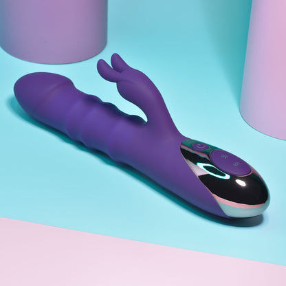 Purple and black electronic device on a colorful background