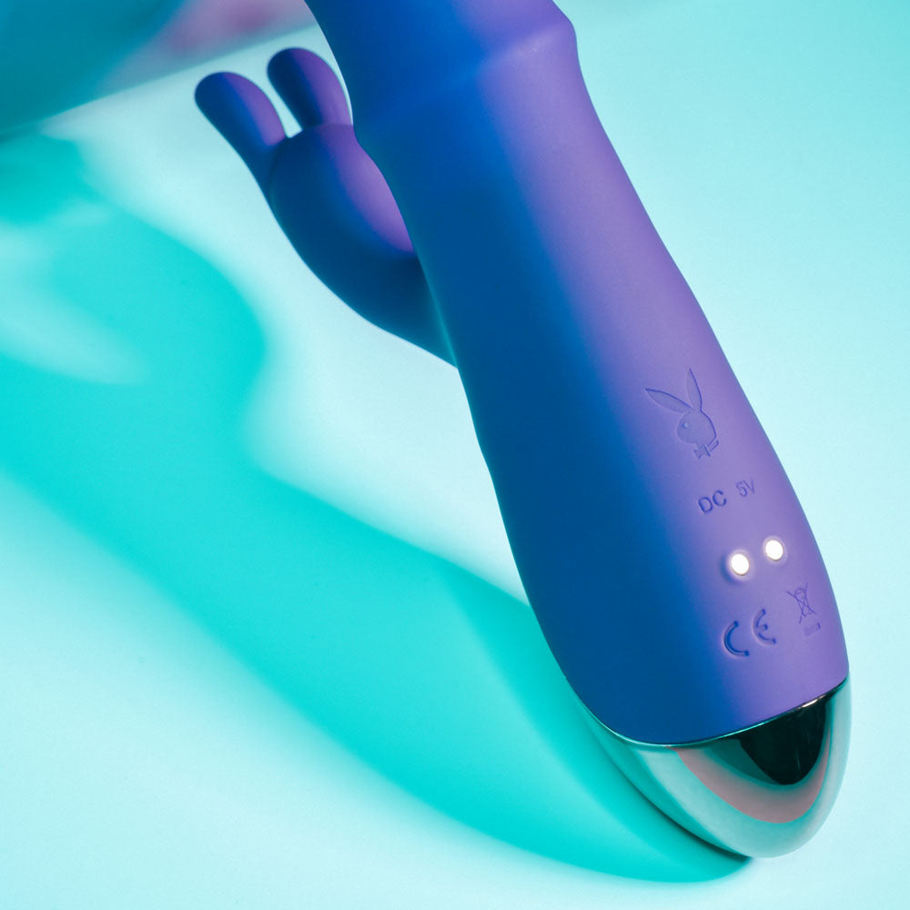 Purple electronic device with branding on a light blue background