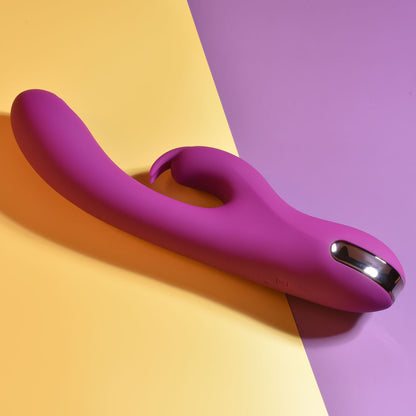 Purple and silver device on a yellow and purple gradient background