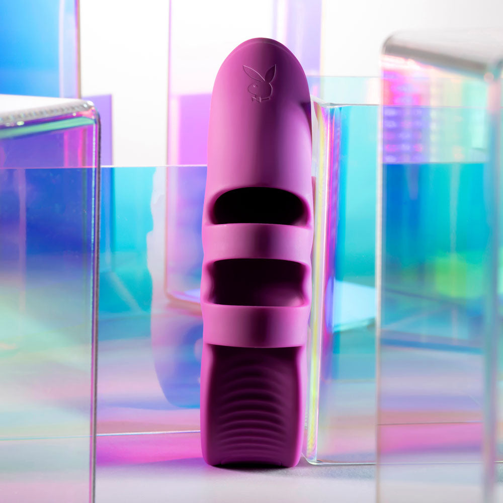 Purple slide sandal on a colorful, reflective surface