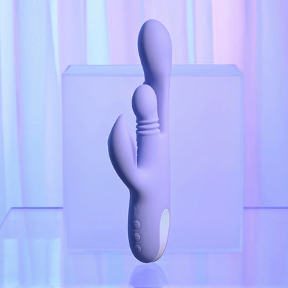 Purple electronic device on a reflective surface with a gradient background