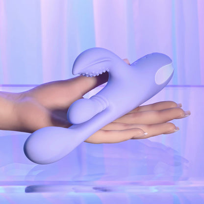 Purple silicone tool being held by a hand against a blurred background