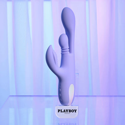 Purple toy with 'Playboy' branding on a gradient background