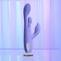 Playboy branded purple and white toy on a gradient background