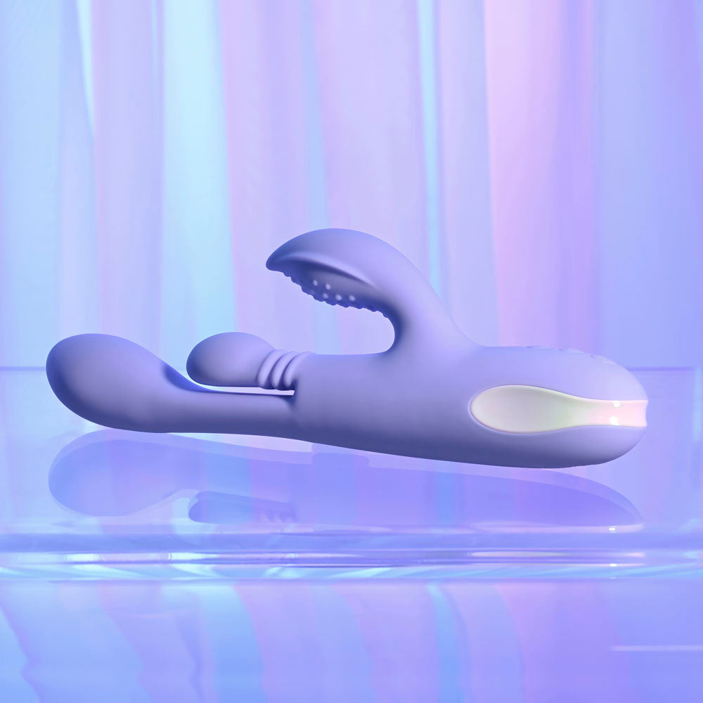 Purple handheld electronic device on a reflective surface with a gradient purple background