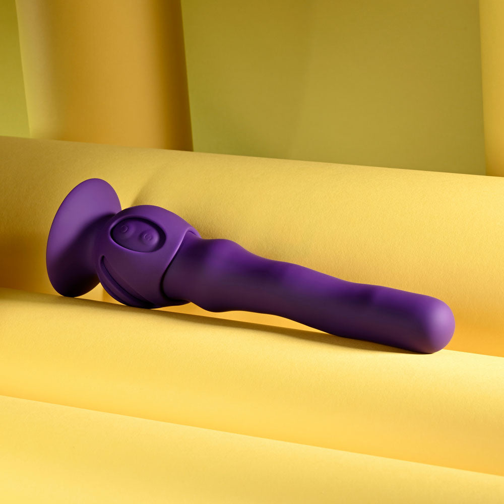 Purple kitchen tool on a yellow fabric background
