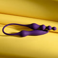 Purple silicone wand on a yellow background