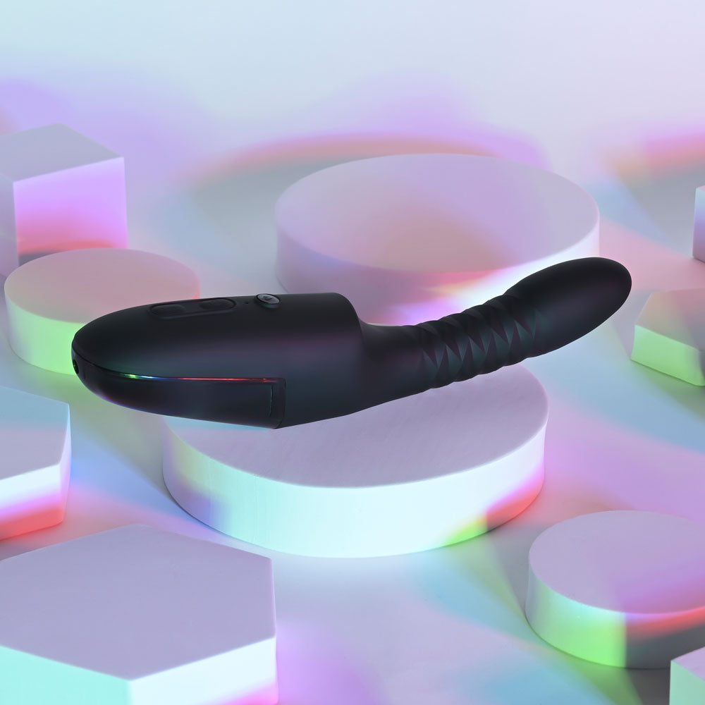 Black electronic device on a colorful geometric background