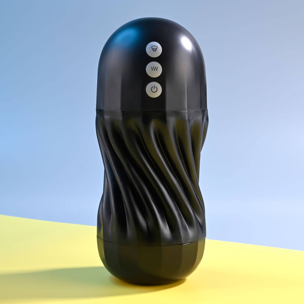 Black textured cylindrical device with control buttons on a yellow and blue gradient background