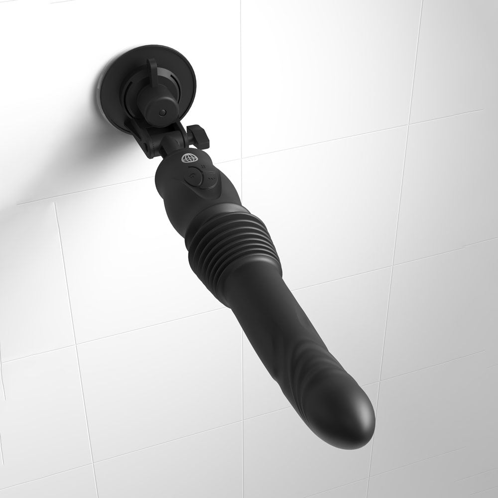 Black bathroom scrubber with a handle on a white background