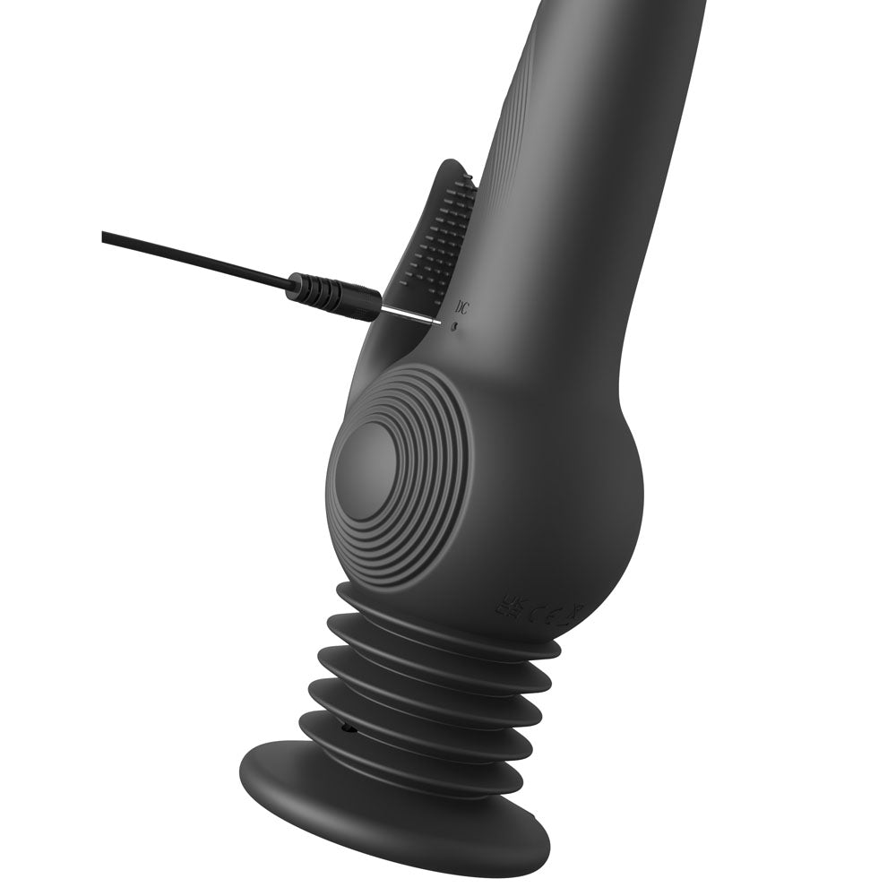Black massage gun on a white background