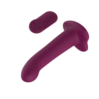 Purple handheld massager on a white background