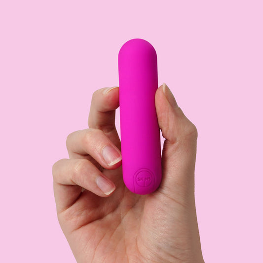 Skins Super Excite Rechargeable Pink Bullet. Styled with other products.