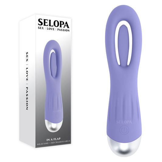 Purple silicone product with silver base next to its packaging on a white background