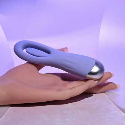 Hand holding a purple and silver device against a light purple background