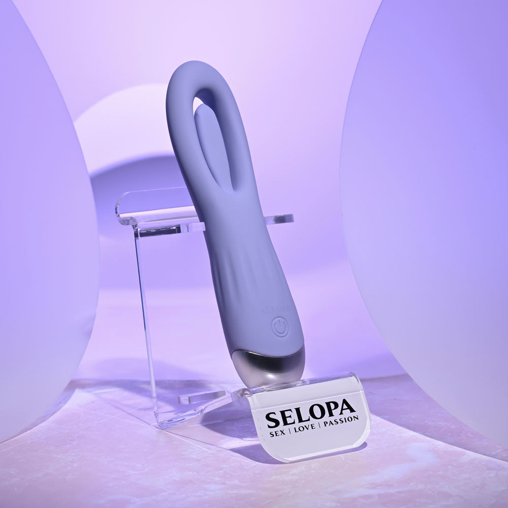 Purple electronic device on a stand with 'SELOPA' branding against a light purple background