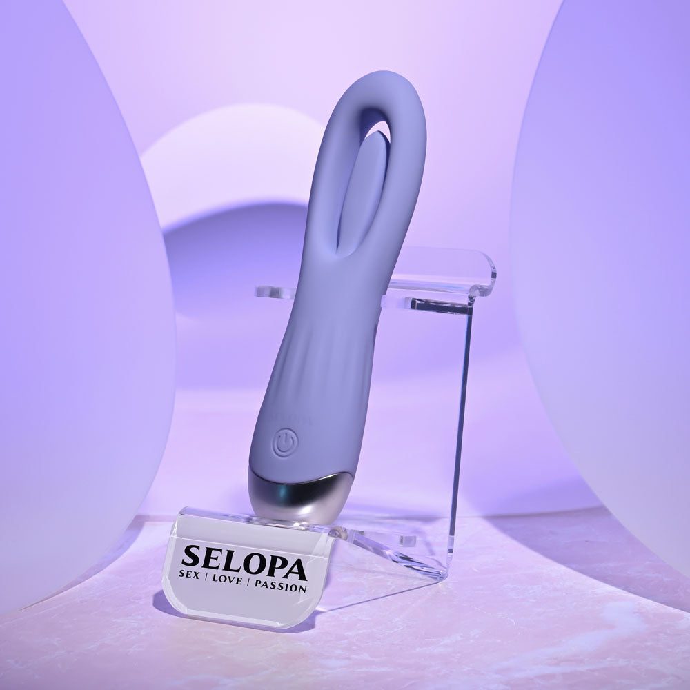 Purple electronic device on a stand with 'SELOPA' branding in a purple-lit setting