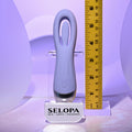 Purple electronic device on a stand with a ruler for scale, branded 'SELOPA'.