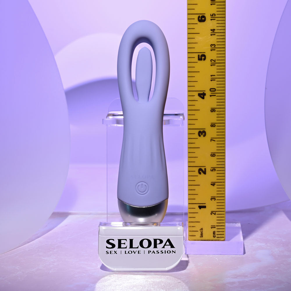Purple electronic device on a stand with a ruler for scale, branded 'SELOPA'.