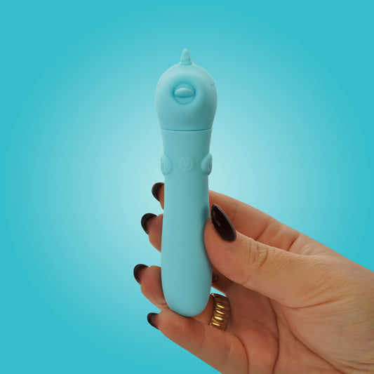 Unihorn USB Bullet. The teal bullet on a coloured surface, tighter crop.