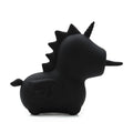 Black dinosaur-shaped toy on a white background