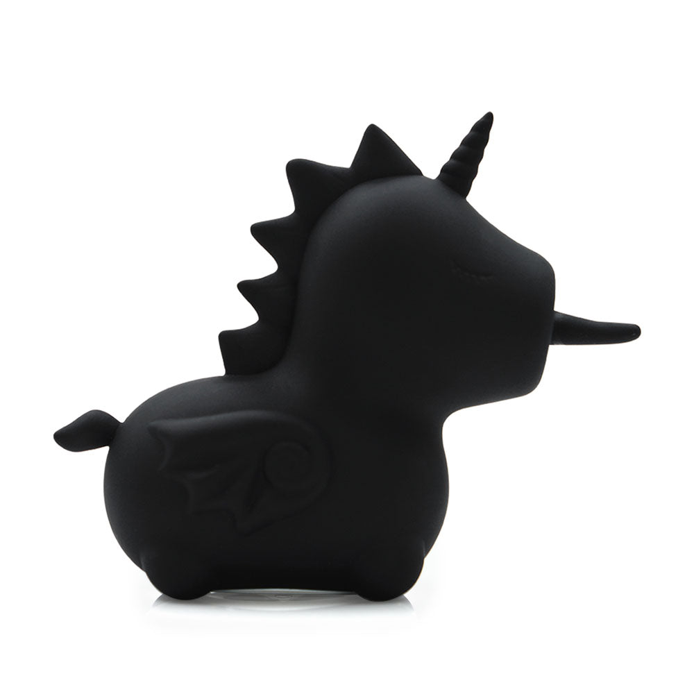 Black dinosaur-shaped toy on a white background