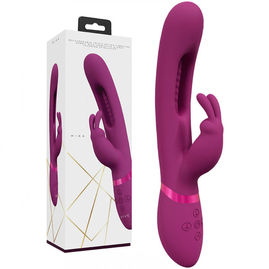 Purple electronic device with control panel next to its packaging on a white background