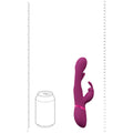 Purple toy with a can for scale on a white background